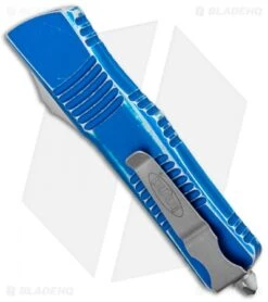 Microtech Combat Troodon D/E OTF Automatic Blue Distressed (3.8" Apocalyptic) -Blade HQ Shop Microtech Combat Troodon DE OTF Auto Blue Distressed SW 142 10DBL BHQ 99299 jr side