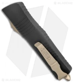 Microtech Combat Troodon D/E OTF Knife Black (3.8" Bronze Full Serr) 142-15 -Blade HQ Shop Microtech Combat Troodon DE OTF Black Bronze Full Serr BHQ 135085 jr side