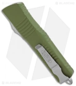 Microtech Combat Troodon OTF D/E Knife OD Green (3.8" Satin Full Serr) 142-6OD -Blade HQ Shop Microtech Combat Troodon OTF DE Auto OD Green Satin Full Serr 142 6OD BHQ 50395 jr side