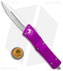 Microtech Combat Troodon OTF Knife D/E Dagger Violet (3.8" Satin Full Serr) -Blade HQ Shop Microtech Combat Troodon OTF Dagger Violet Satin Full Serr 142 6VI BHQ 98100 jr bottlecap