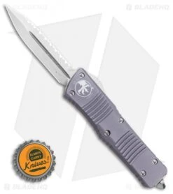 Microtech Combat Troodon OTF Knife D/E Dagger Gray (3.8" Stonewash Full Serr) -Blade HQ Shop Microtech Combat Troodon OTF Knife D E Dagger Gray 3.8 Stonewash Full Serr 142 12GY BHQ 98063 LS Bottlecap
