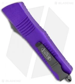 Microtech Combat Troodon S/E OTF Automatic Knife Purple (3.8" Black Serr) -Blade HQ Shop Microtech Combat Troodon SE OTF Auto Pruple Black Serr 143 2PU BHQ 98125 jr side