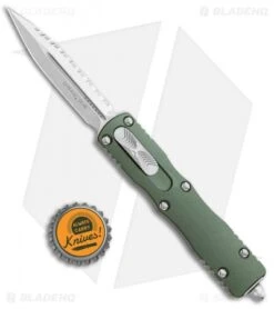Microtech Dirac Dagger OTF Automatic Knife OD Green (2.88" Stonewash Full Serr) -Blade HQ Shop Microtech Dirac Dagger OTF Auto OD Green SW Full Serr BHQ 111330 jr bottlecap 1