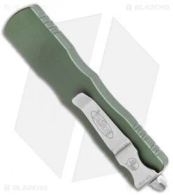 Microtech Dirac Dagger OTF Automatic Knife OD Green (2.88" Stonewash Full Serr) -Blade HQ Shop Microtech Dirac Dagger OTF Auto OD Green SW Full Serr BHQ 111330 jr side