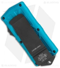 Microtech Exocet Dagger CA Legal OTF Automatic Knife Teal (1.9" Black Serr) -Blade HQ Shop Microtech Exocet Dagger CA Legal OTF Auto Turquoise Black Serr 157 2TQ BHQ 115028 jr side