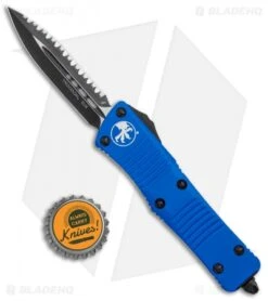 Microtech Blue Troodon D/E OTF Automatic Knife (3" Black Full Serr) 138-3BL -Blade HQ Shop Microtech Troodon DE OTF Blue Black Full Serr 138 3BL BHQ 12601 jr bottlecap
