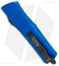 Microtech Blue Troodon D/E OTF Automatic Knife (3" Black Full Serr) 138-3BL -Blade HQ Shop Microtech Troodon DE OTF Blue Black Full Serr 138 3BL BHQ 12601 jr side