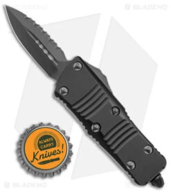 Microtech Troodon Mini D/E CA Legal OTF Auto Black (1.9" Black DLC Serr) -Blade HQ Shop Microtech Troodon Mini DE CA Legal OTF Auto Shadow Black DLC Serr BHQ 146607 jr bottlecap