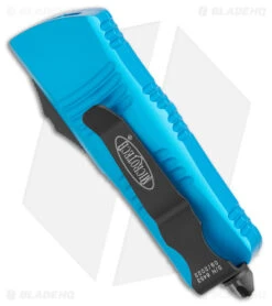 Microtech Troodon Mini D/E OTF Automatic Knife Turquoise (1.9" Black) -Blade HQ Shop Microtech Troodon Mini DE OTF Auto Turquoise Black BHQ 176097 jr side