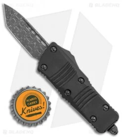 Microtech Signature Series Troodon Mini T/E CA Legal OTF Auto Black (1.9" Dam) -Blade HQ Shop Microtech Troodon Mini TE CA Legal OTF Black Damascus BHQ 118373 jr bottlecap