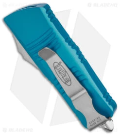 Microtech Troodon Mini D/E CA Legal OTF Auto Knife Turquoise (1.9" Stonewash) -Blade HQ Shop Microtech Troodon Mini Troodon DE AK Turquoise 1in SW BHQ 174568 td side