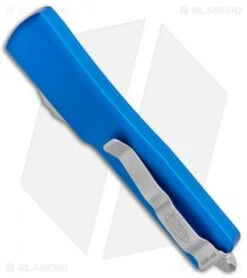 Microtech UTX-70 D/A OTF D/E Automatic Knife Blue (2.4" Stonewash Serr) -Blade HQ Shop Microtech UTX 70 DA OTF DE Auto Blue SW Serr 147 11BL BHQ 98266 jr side