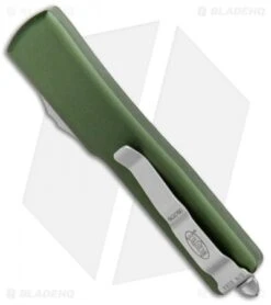 Microtech UTX-70 D/E OTF Automatic Knife OD Green CC (2.4" Satin) 8 Microtech UTX-70 D/E OTF Automatic Knife OD Green CC (2.4" Satin) -Blade HQ Shop Microtech UTX 70 DE Auto OD Green CC Satin BHQ 72318 jr side