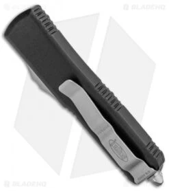 Microtech UTX-85 D/E OTF Automatic Knife Black (3.125" Stonewash Full Serr) -Blade HQ Shop Microtech UTX 85 DE OTF Auto Black SW Full Serr 232 12 BHQ 100772 jr side