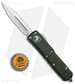 Microtech UTX-85 D/E OTF Automatic Knife OD Green (3.125" Satin Full Serr) -Blade HQ Shop Microtech UTX 85 DE OTF Auto OD Green Satin Serr Full 232 6OD BHQ 90985 jr bottlecap