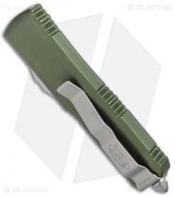 Microtech UTX-85 S/E OTF Automatic Knife OD Green (3.125" Stonewash Serr) 8 Microtech UTX-85 S/E OTF Automatic Knife OD Green (3.125" Stonewash Serr) -Blade HQ Shop Microtech UTX 85 SE OTF OD Green SW Serr 231 11OD BHQ 72340 jr side