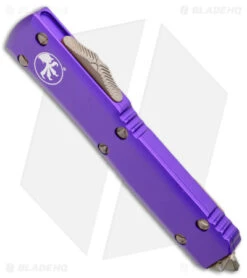 Microtech Ultratech Bayonet OTF Knife Purple Al (3.4" Bronze Apocalyptic) 7 Microtech Ultratech Bayonet OTF Knife Purple Al (3.4" Bronze Apocalyptic) -Blade HQ Shop Microtech Ultratech Bayo OTF Auto Purple Bronze Apocalyptic BHQ 175645 jr spine